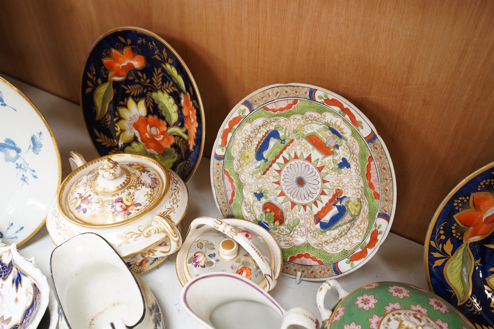 A collection of early 19th century English porcelain tea, dessert and dinner wares including Derby dessert plates, Bloor Derby, Barr Flight & Barr plate, Spode, Coalport etc.